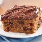 Chocolate Frosted Sweet Potato Sheet Cake on a white plate