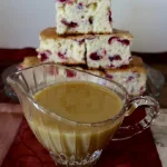 Cranberry Snack Cake with Sweet Potato-Maple Hard Sauce in a serving dish