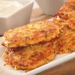 Crunchy Sweet Potato Pancakes on a white serving dish