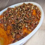 Orange Praline Yams in a white dish