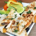 Sweet Potato & Black Bean Quesadillas cut on a white plate