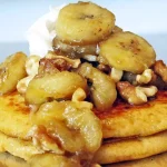 Stack of Sweet Potato Pancakes topped with bananas